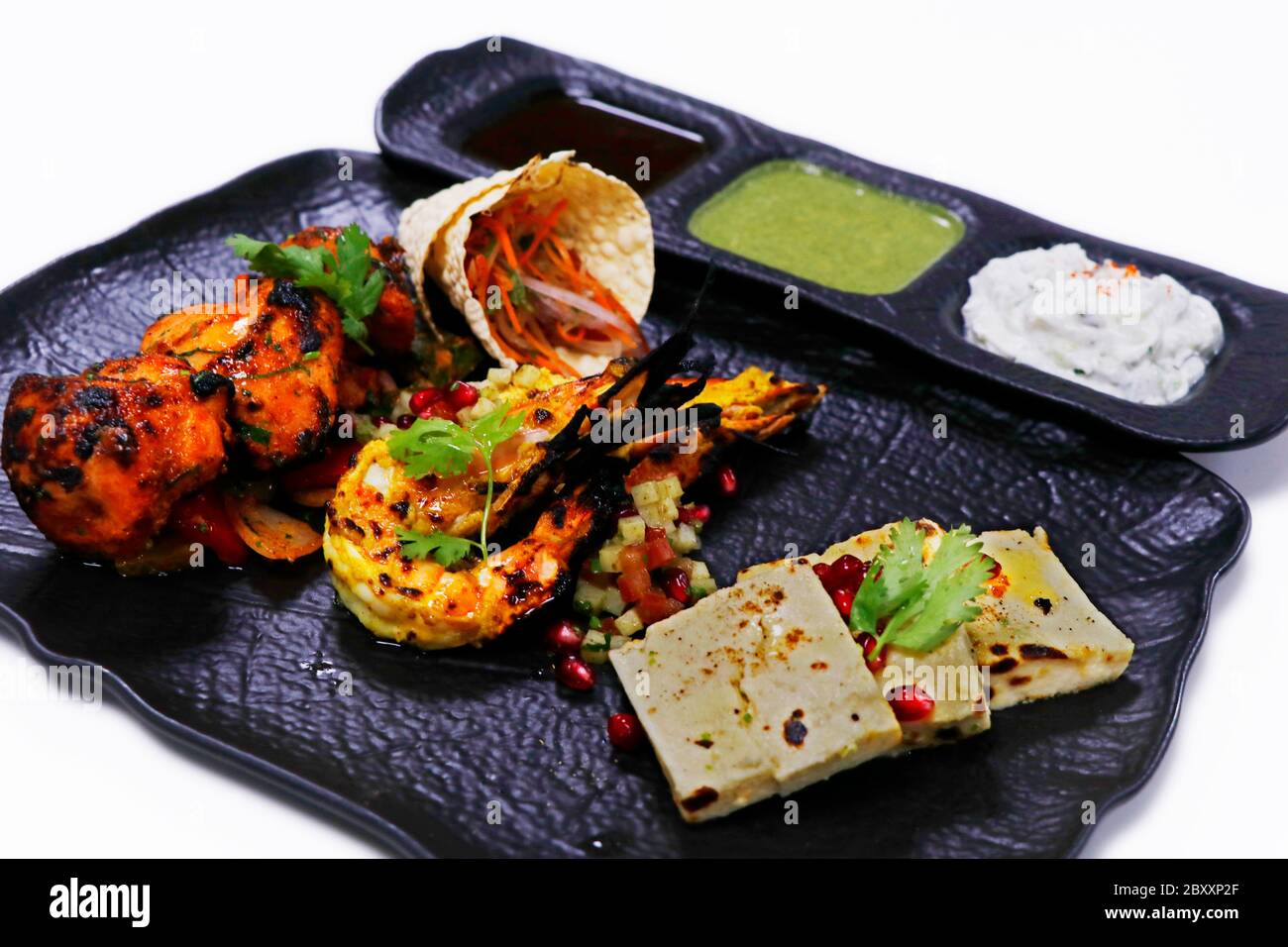 tandoori platter with chicken tikka, grilled prawns, and paneer along