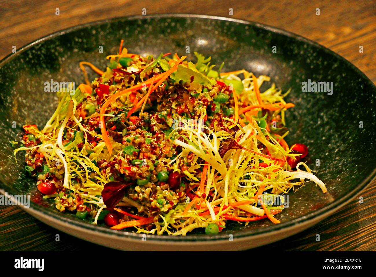 quinoa salad with bell peppers, avocado, beans and carrots Stock Photo