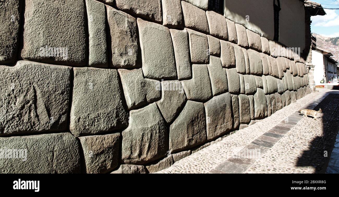 Hatun Rumiyoc street with Incan twelve angle stone in Cusco, Peru. Stock Photo