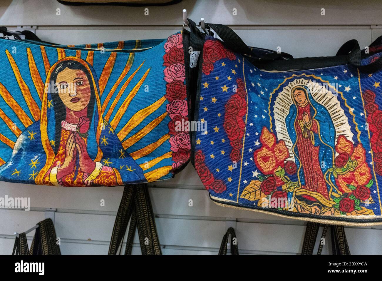 shoulder bags with depictions of the 'Virgin Mary' for sale in Old Town Albuquerque, New Mexico Stock Photo