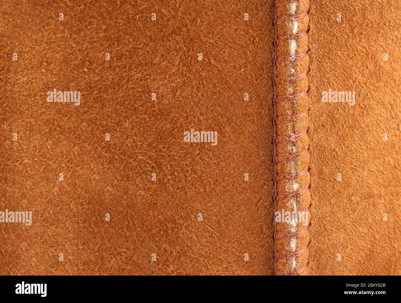 A Brown suede background with seam Stock Photo