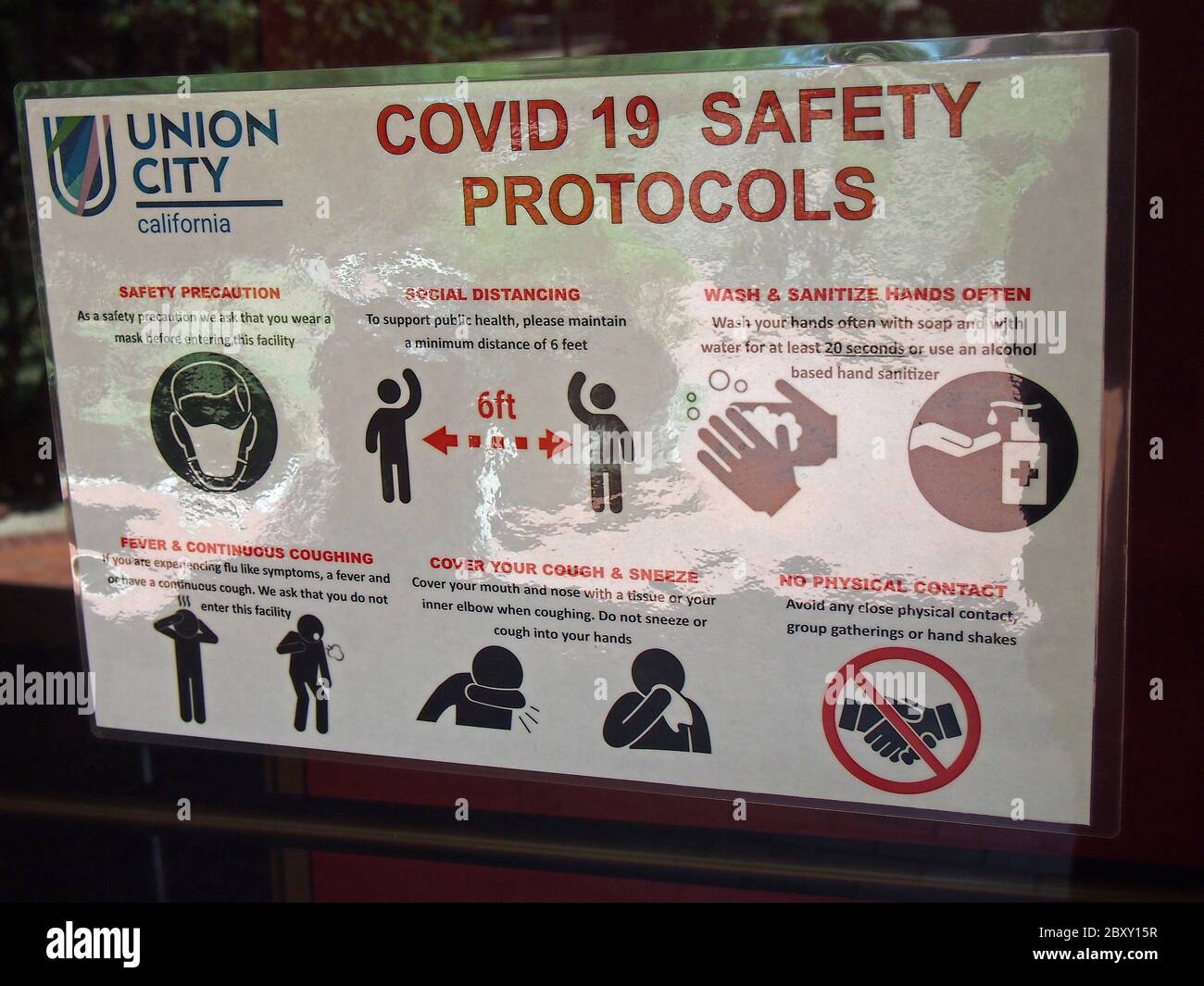 Union city Covid-19 safety protocols sign at a retail store entrance, California, Stock Photo