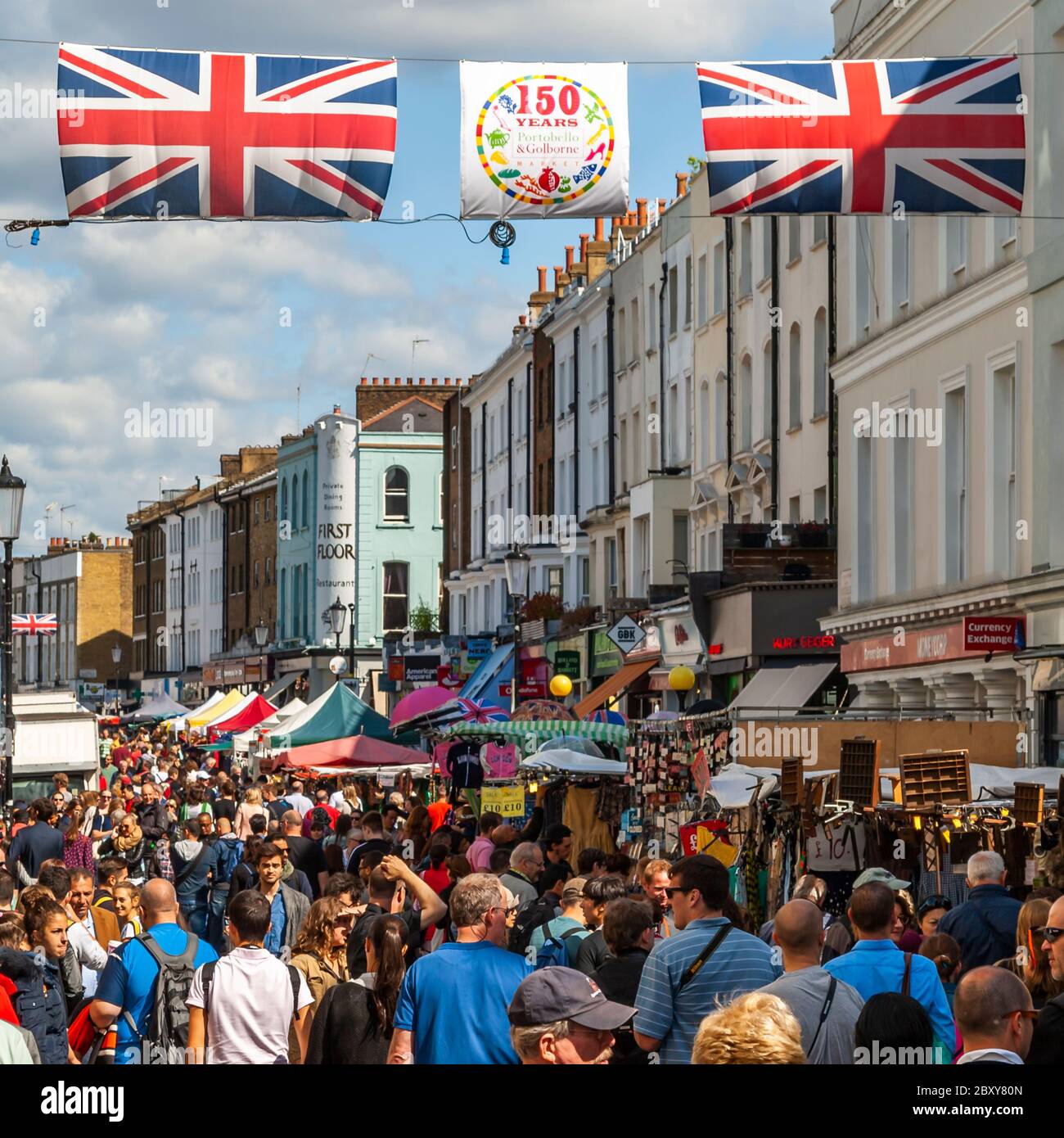 Crowds roll through Portobello Road in the Royal Borough of Kensington and Chelsea, England Stock Photo