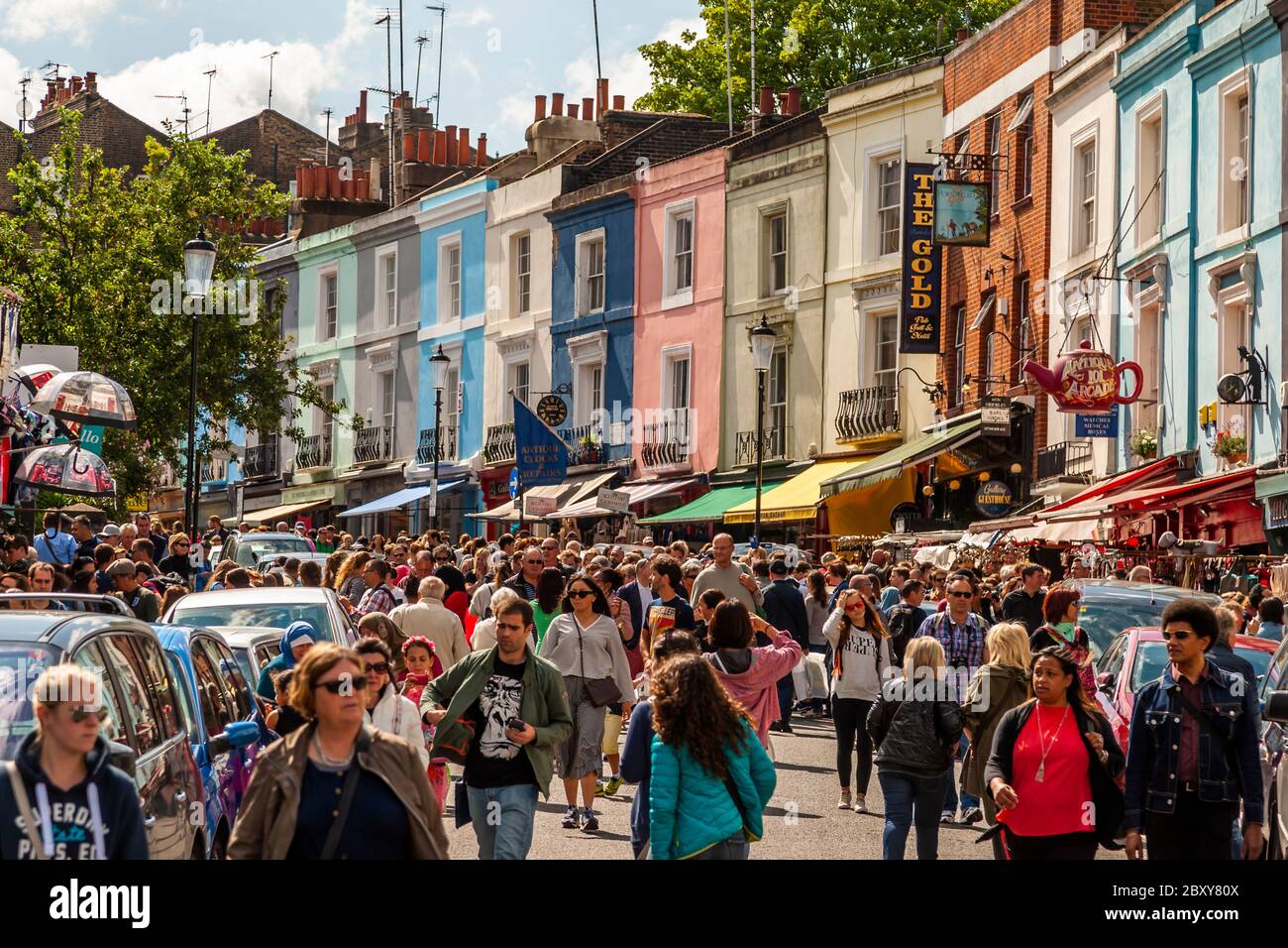 Crowds roll through Portobello Road in the Royal Borough of Kensington and Chelsea, England Stock Photo