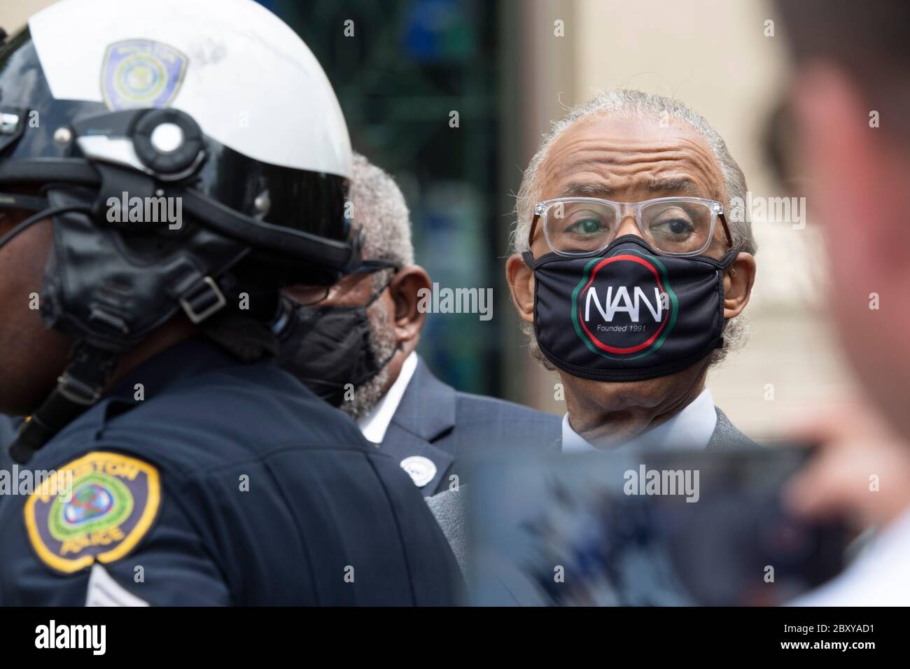 Rev. Al Sharpton, wearing a National Action Network face mask, joins thousands of mourners at Fountain of Praise church in southwest Houston during a six-hour public visitation for GEORGE FLOYD. Floyd's death by a white police officer in Minneapolis sparked worldwide protests against racism and police brutality. Stock Photo