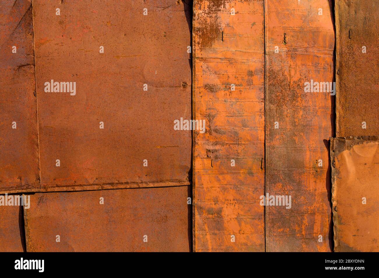 rusted tin sheets patchwork wall texture and flat background Stock Photo