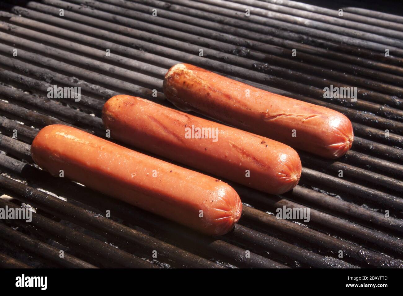 Hot dogs on a bbq Stock Photo