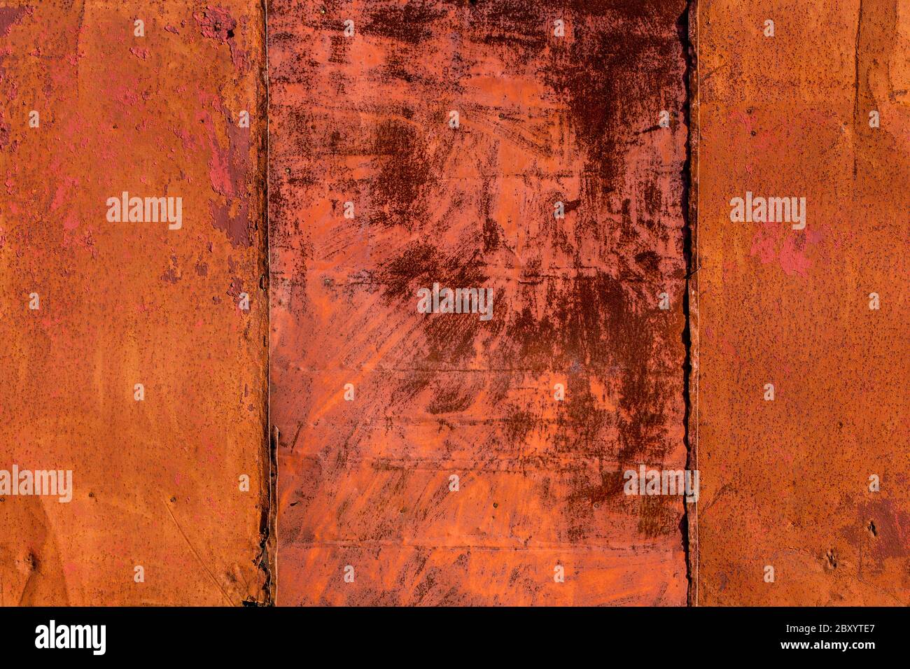 rusted tin sheets patchwork wall texture and flat background Stock Photo