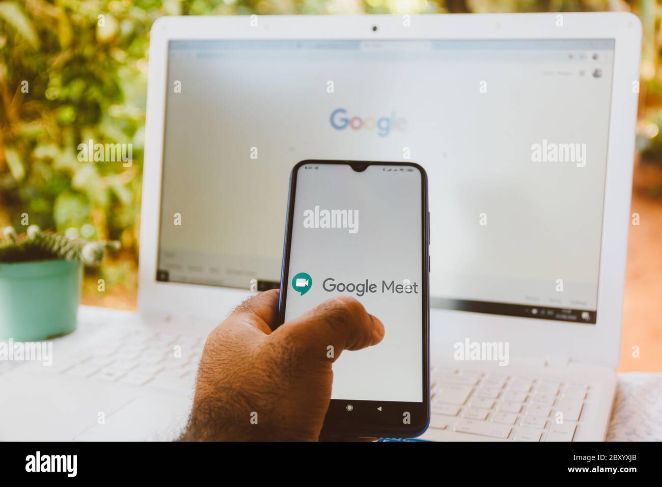 In this photo illustration a MeWe app seen displayed on a smartphone with  the MeWe logo in the background. (Photo by Thiago Prudencio / SOPA  Images/Sipa USA Stock Photo - Alamy