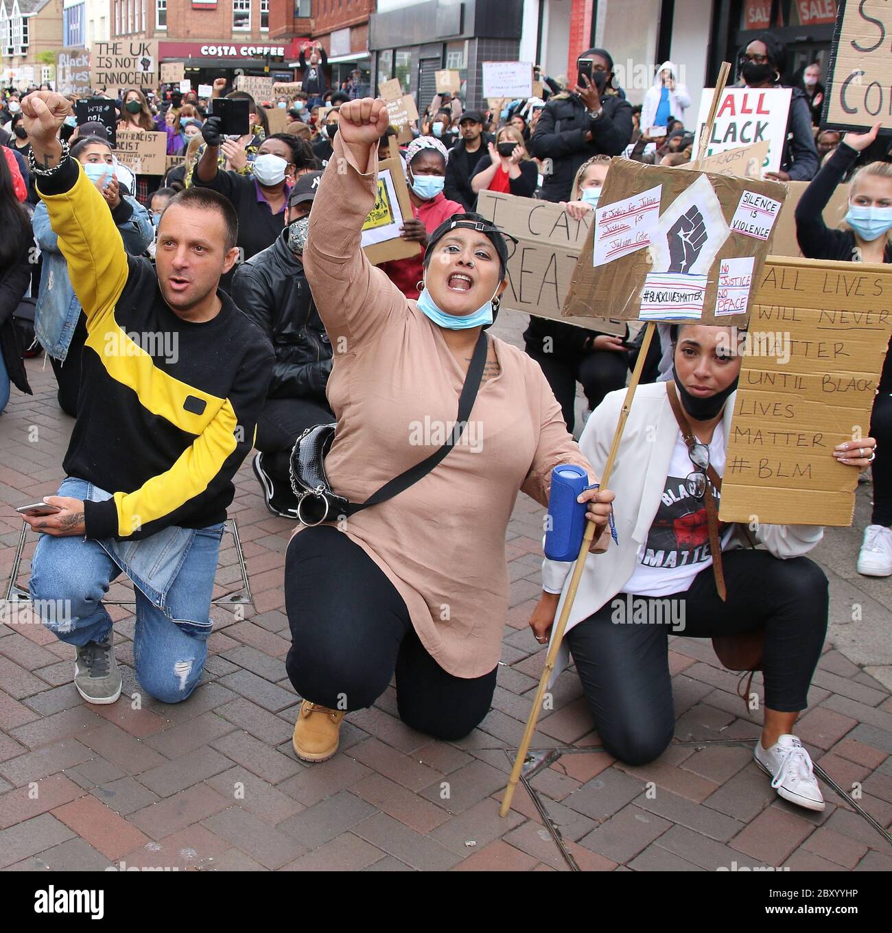 Protesters Take A Knee While Holding Up Their Fists During The Demonstration Hundreds Of People Turned Out In Bedford Town Centre To Hold A Peaceful Demonstration As Part Of A Worldwide Black Lives