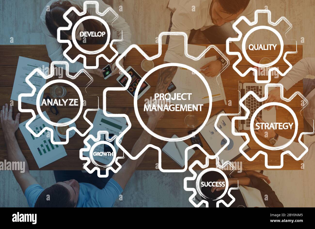 Gears with project management features over business team Stock Photo