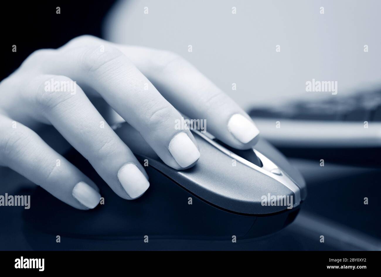 Female hand holding computer mouse Stock Photo - Alamy