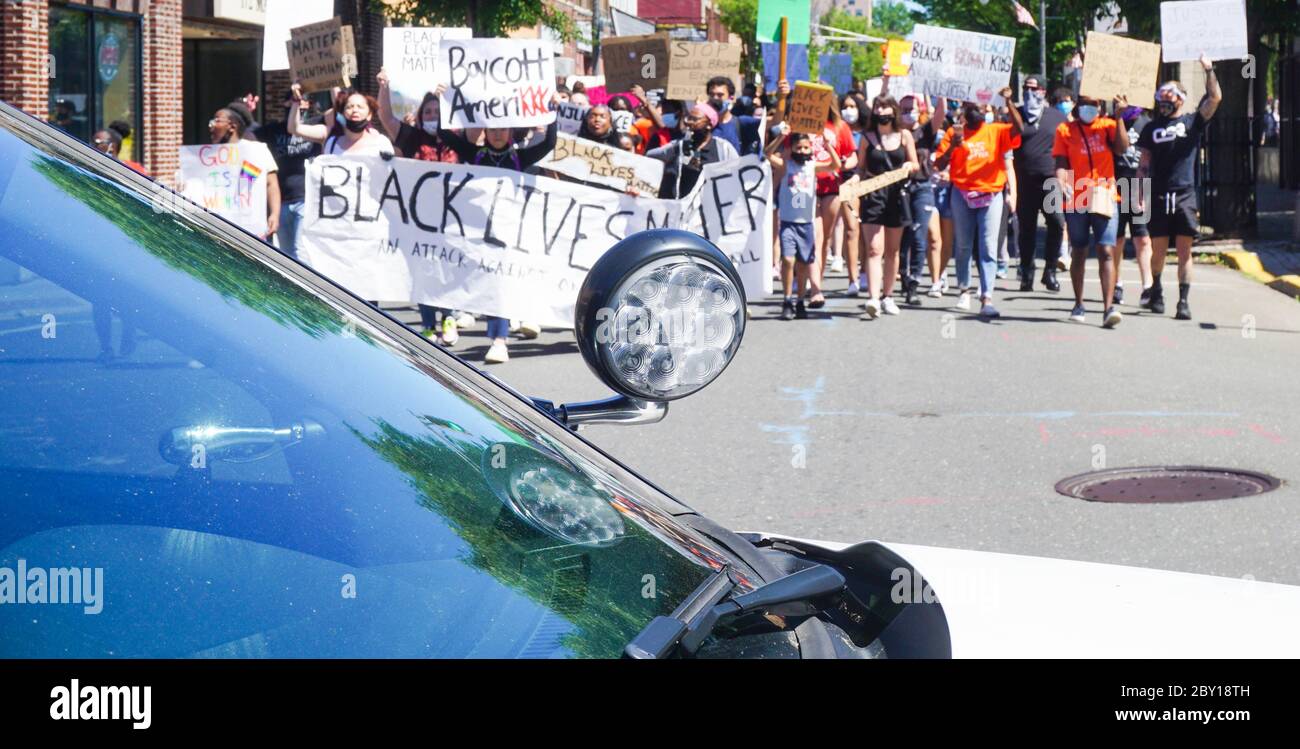 Black Lives Matter Protest George Floyd March passing in front of police vehicle peaceful stock photograph - Ridgefield park bergen county new jersey Stock Photo