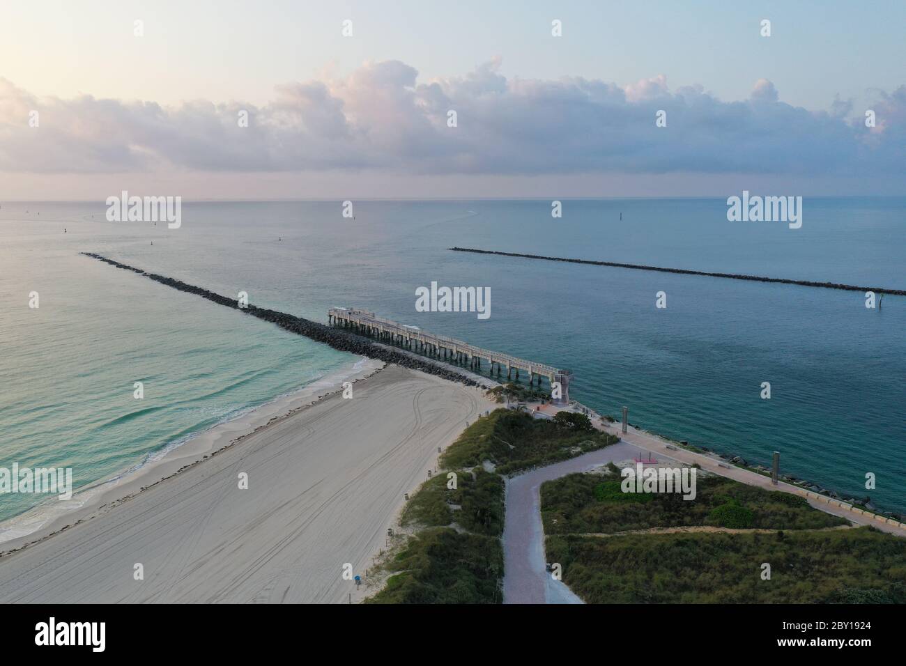Aerial view of Government Cut and South Pointe Park on Miami Beach, Florida at sunrise in calm weather during COVID-19 shutdown. Stock Photo