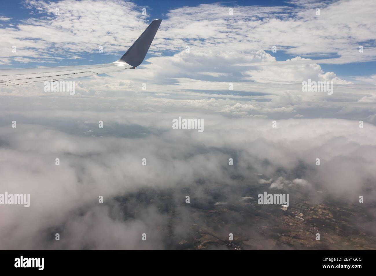 Blue sky with clouds background on the airplan Stock Photo - Alamy