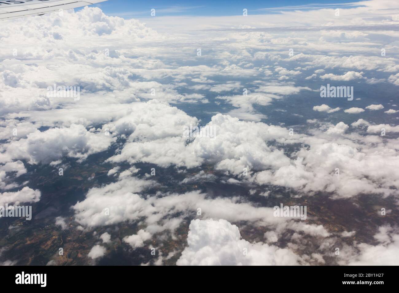 Blue sky with clouds background on the airplan Stock Photo - Alamy