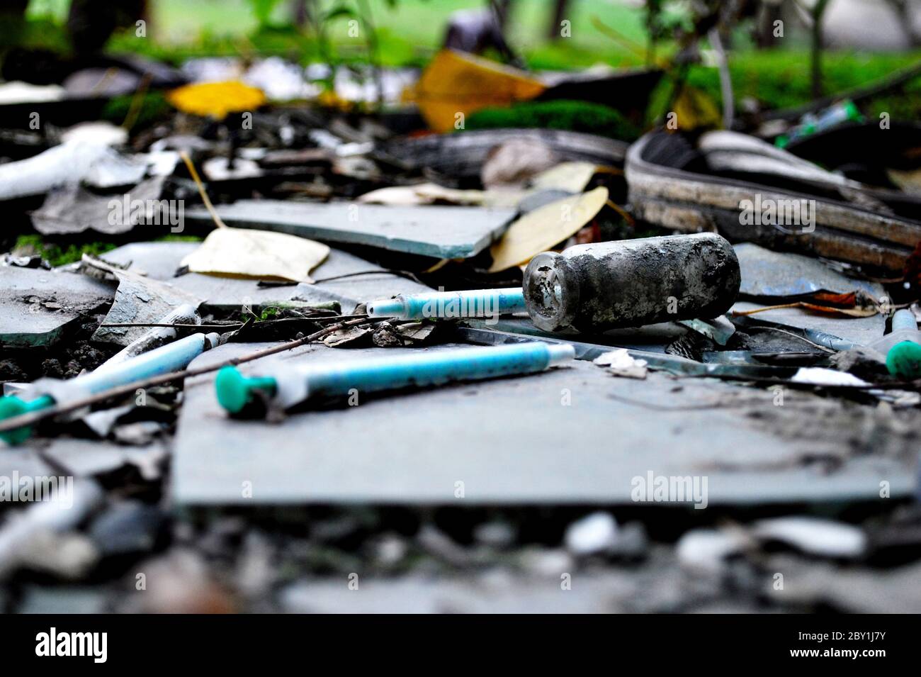 narcotic syringes in the junkyard Stock Photo