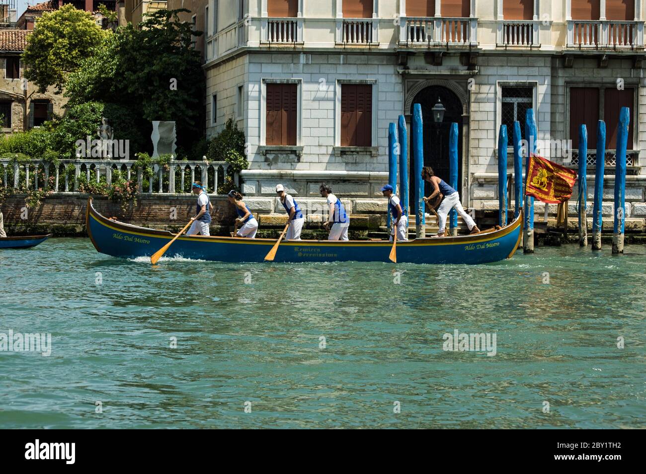 Venice, Italy - June 12, 2011:  Oarsmen racing along the Grand Canal in the Venice Vogalonga regatta on June 12 2011. Over a thousand boats take part Stock Photo