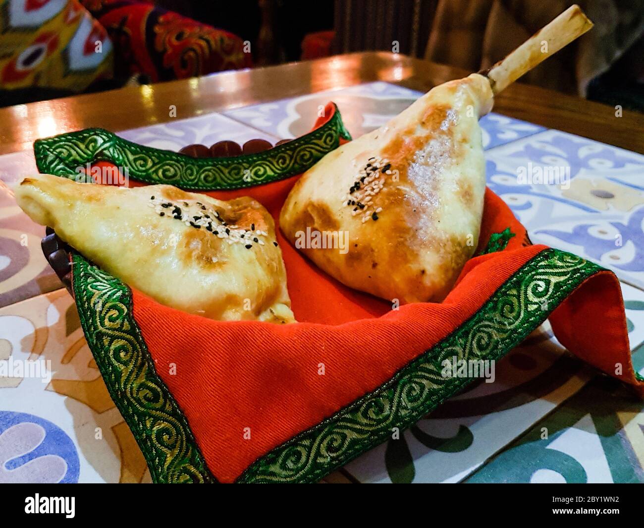 Close up photo of samsa, a popular Central Asian dish commonly attributed to Kyrgyz cuisine. Stock Photo
