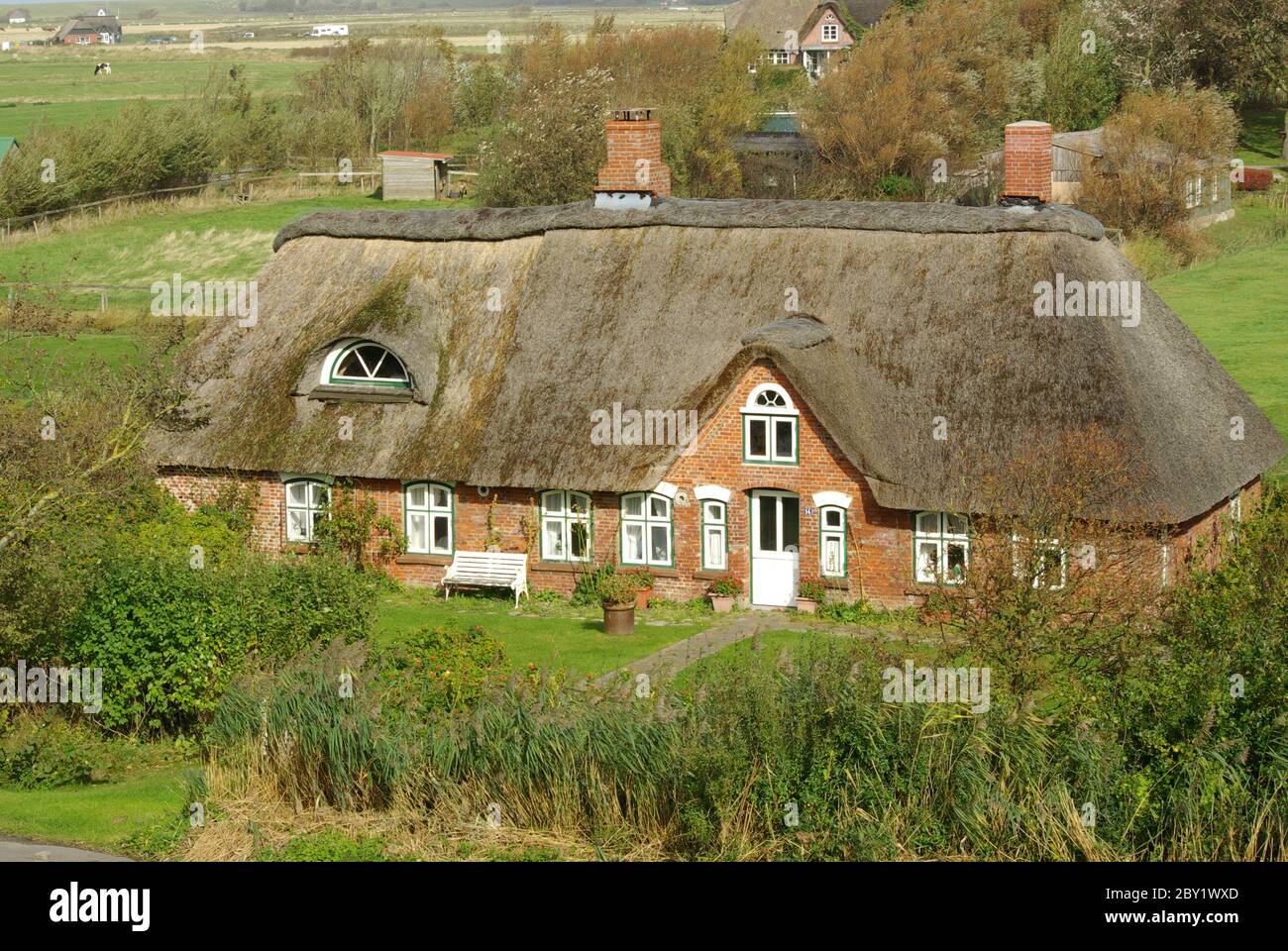 Frisian house on the dike Stock Photo