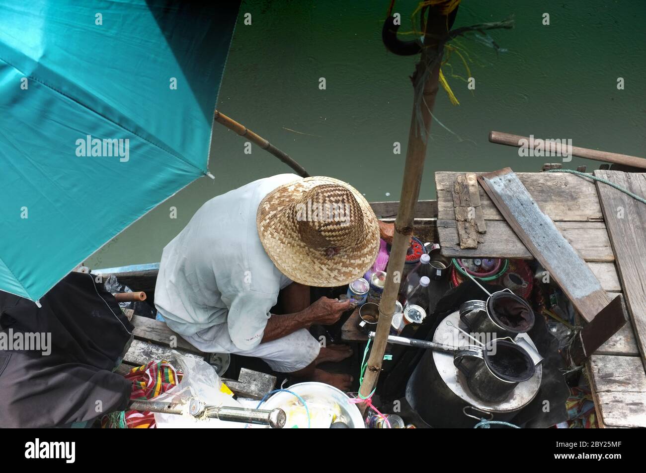 Old man sells ancient coffee pour boiling hot water into an coffee pot