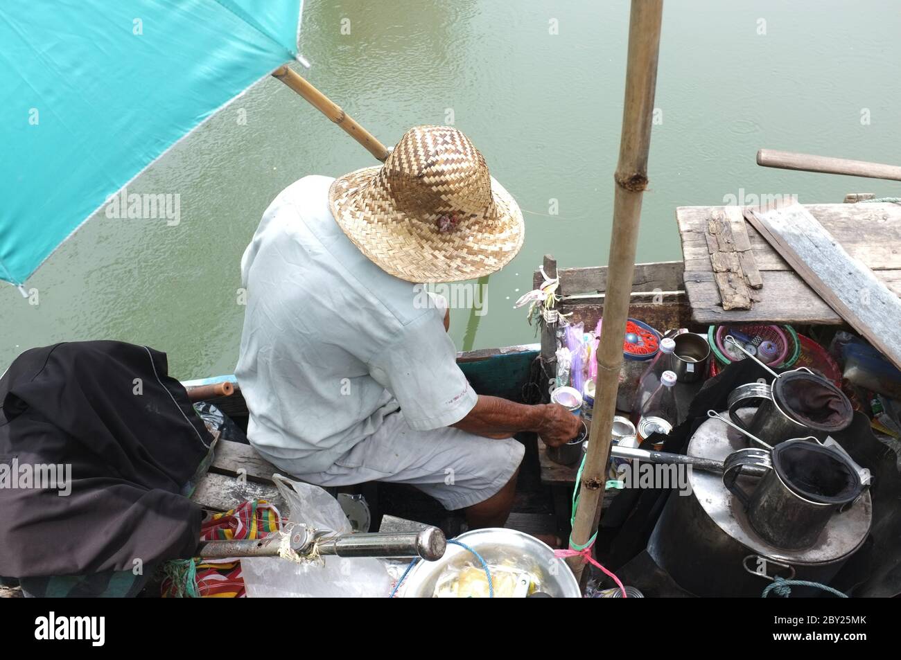 Old man sells ancient coffee pour boiling hot water into an coffee pot