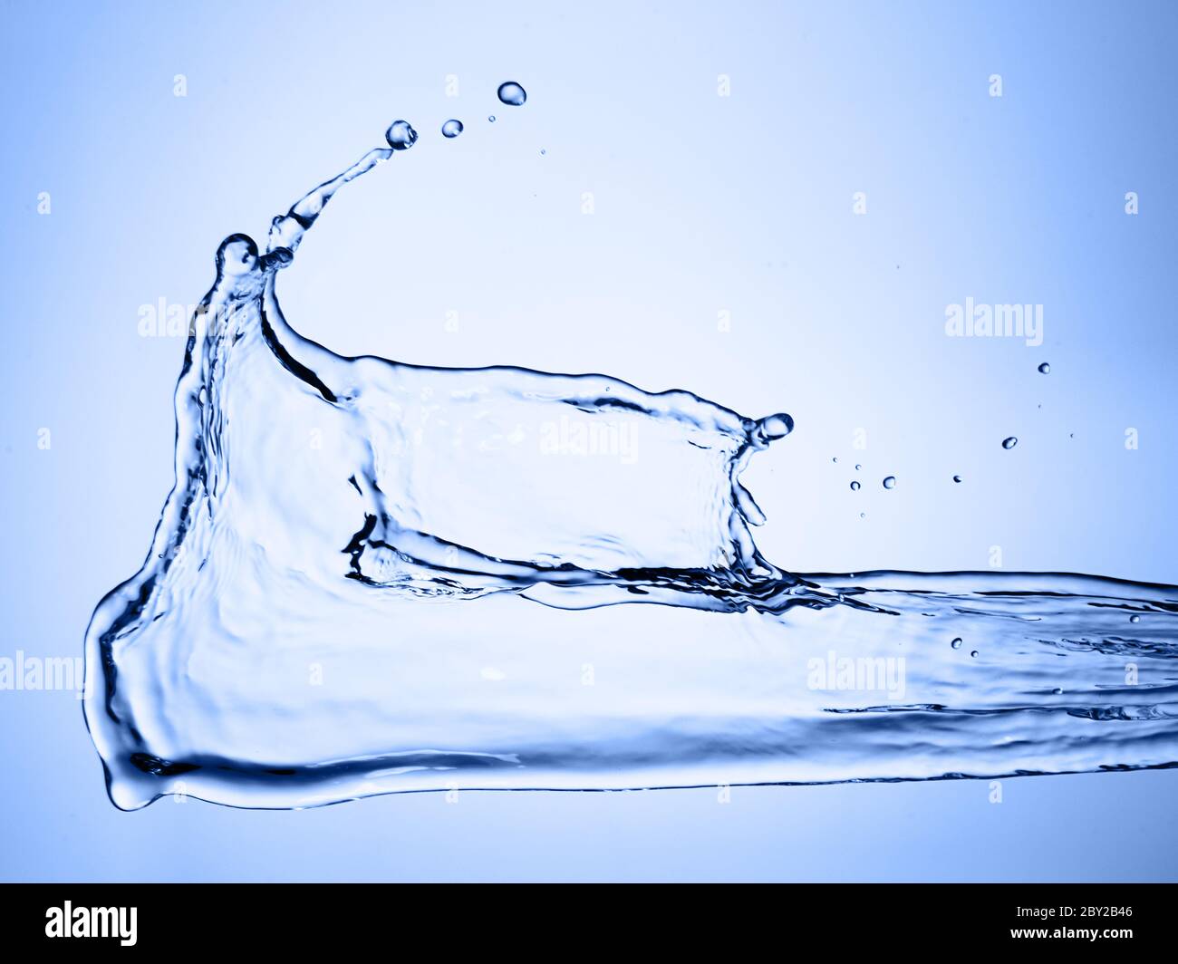 water splash on blue background Stock Photo - Alamy