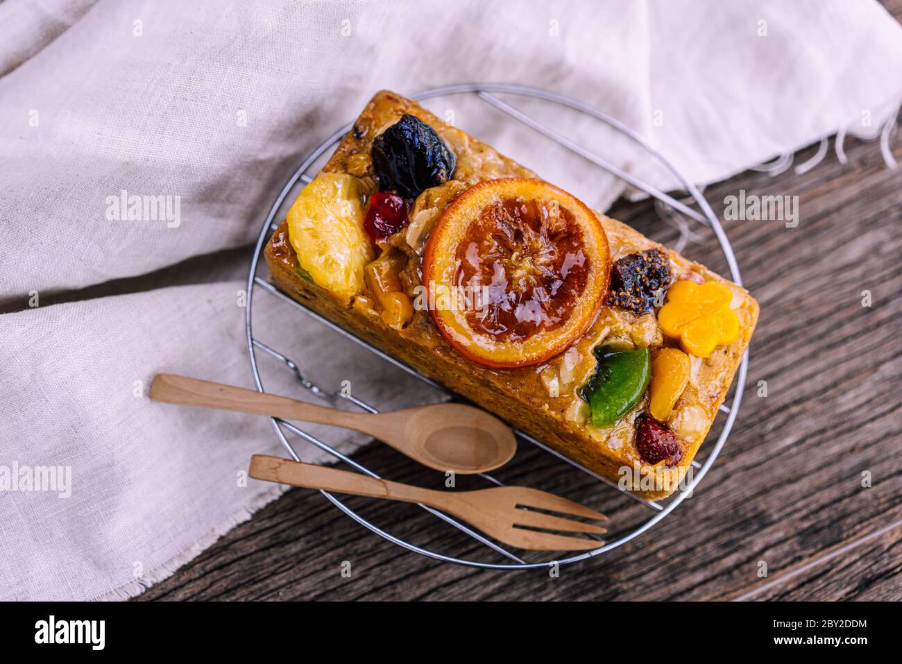 Fresh homemade fruit cake with juicy candied fruits topping Stock Photo
