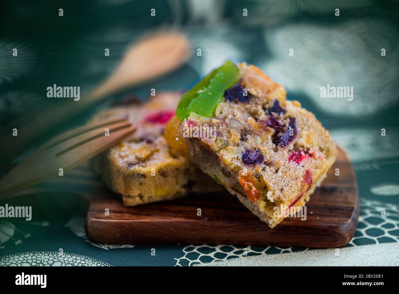 Fresh sliced homemade fruit cake with juicy candied fruits Stock Photo