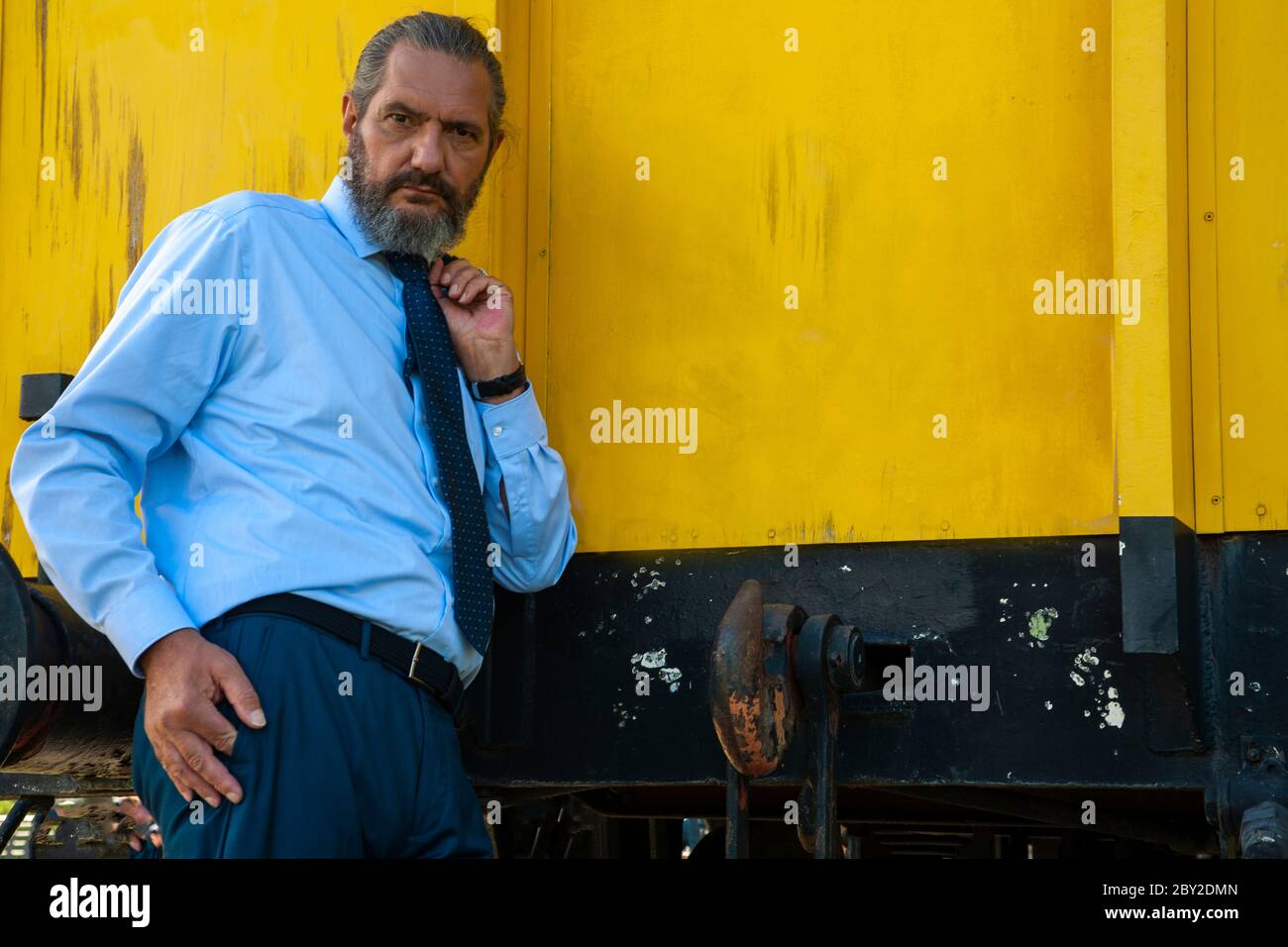 best ager posing on a steel construction Stock Photo Alamy