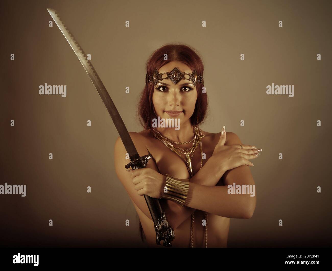 warrior woman holding sword Stock Photo