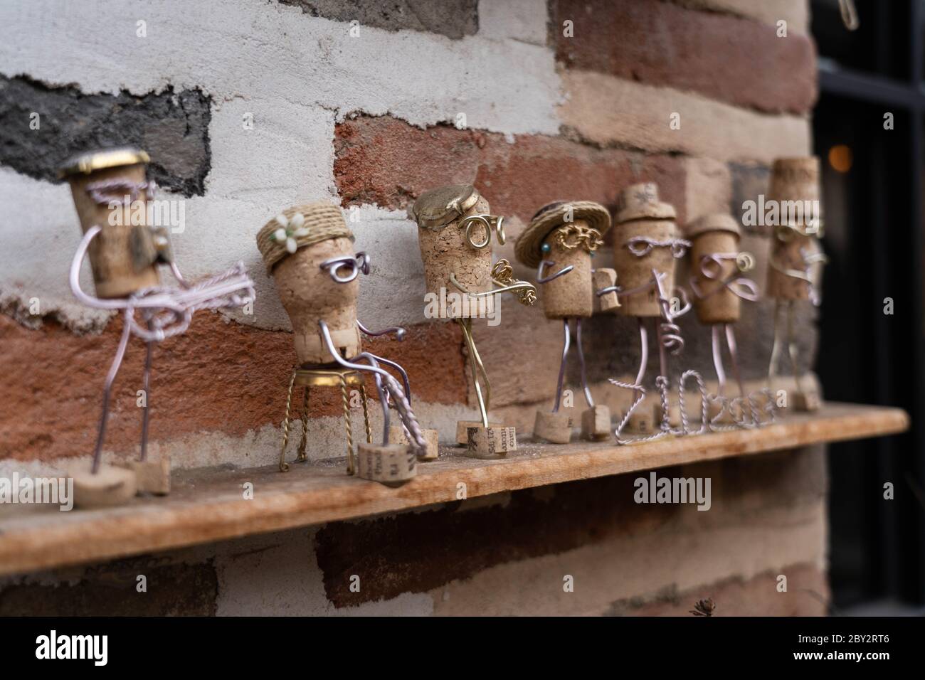 Creative decoration made from wine cork on a brick wall Stock Photo
