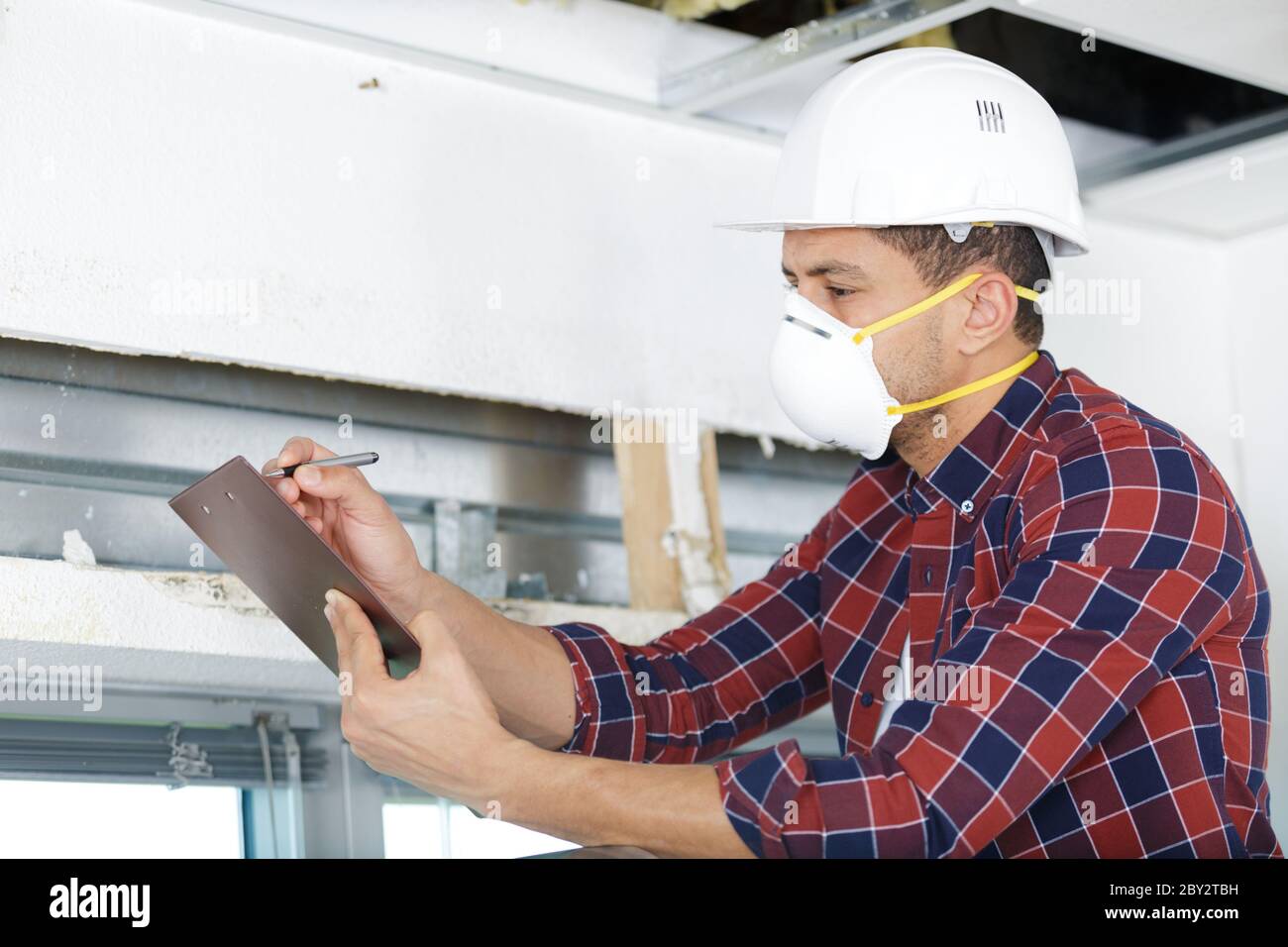 Foreman holding paper pen hi-res stock photography and images - Alamy
