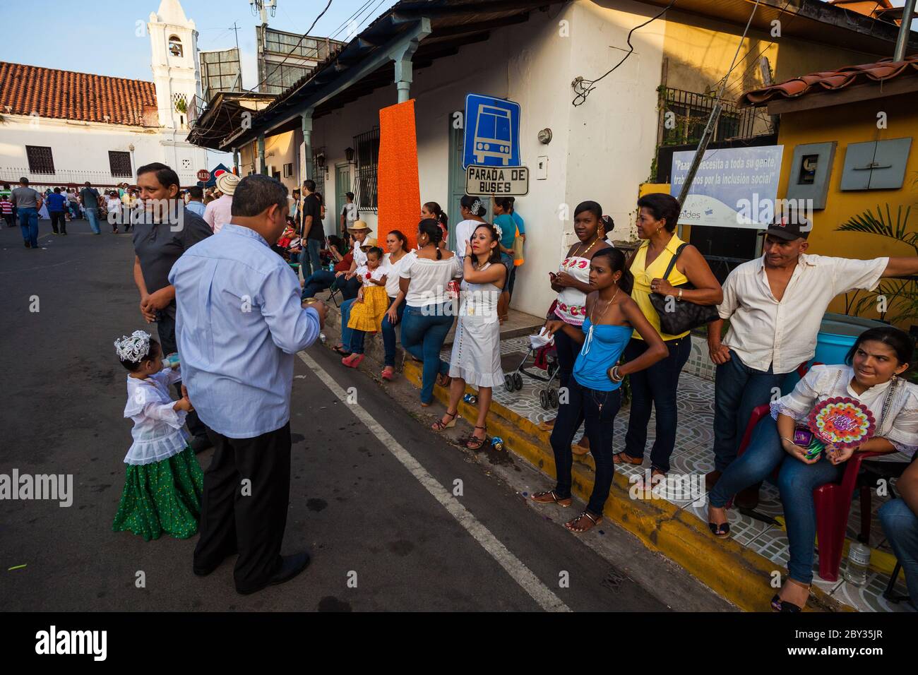 Panamanians at the bus stop on the annual event 'El desfile de las mil polleras' in Las Tablas, Los Santos province, Republic of Panama. Stock Photo