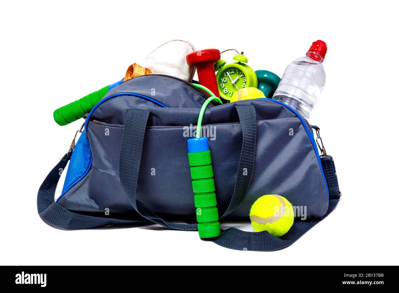 Bicolor blue and grey sports bag with fitness equipment isolated on ...