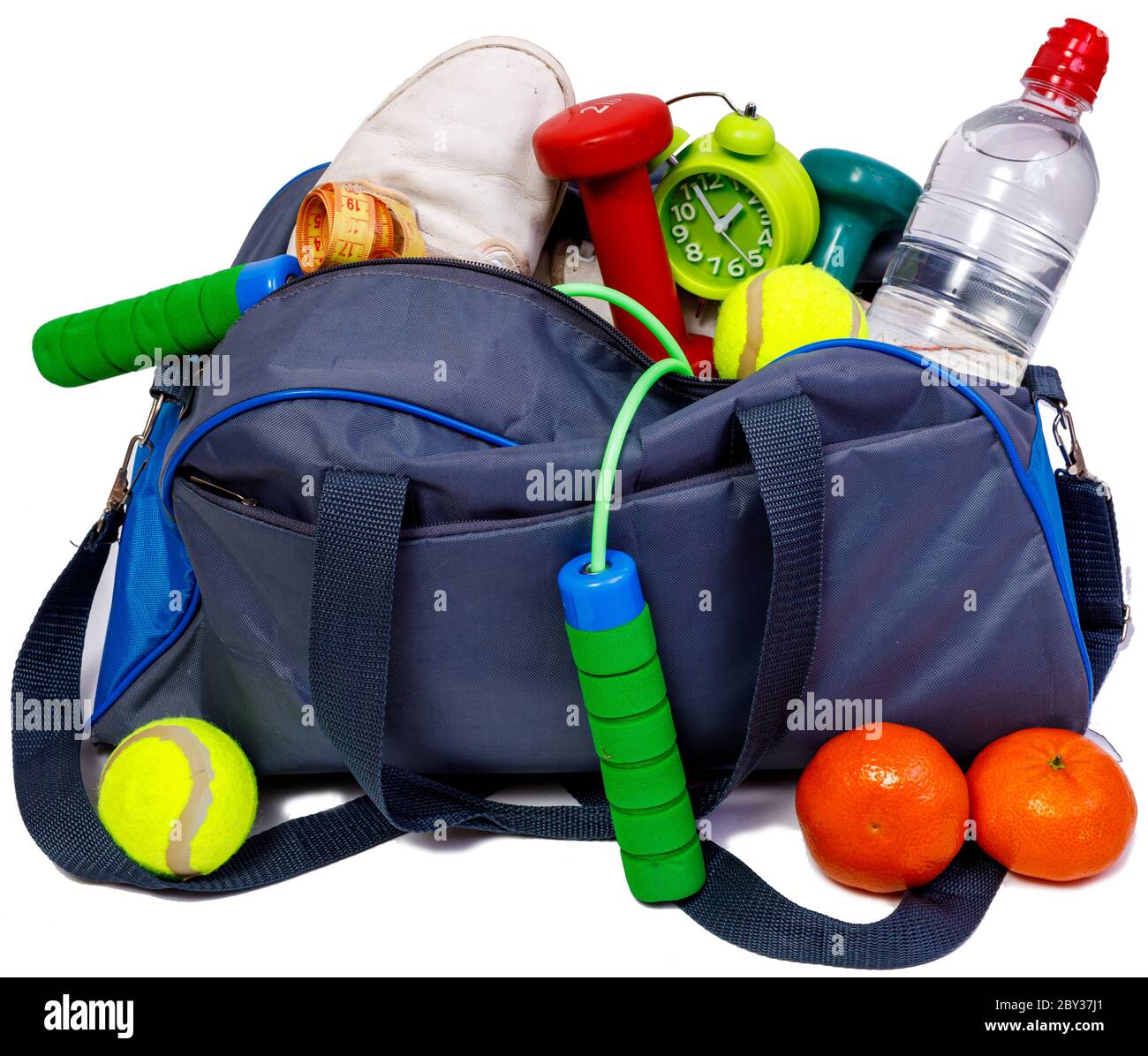 Bicolor blue and grey sports bag with fitness equipment isolated on white background. Best healthy lifestyle conept. Stock Photo