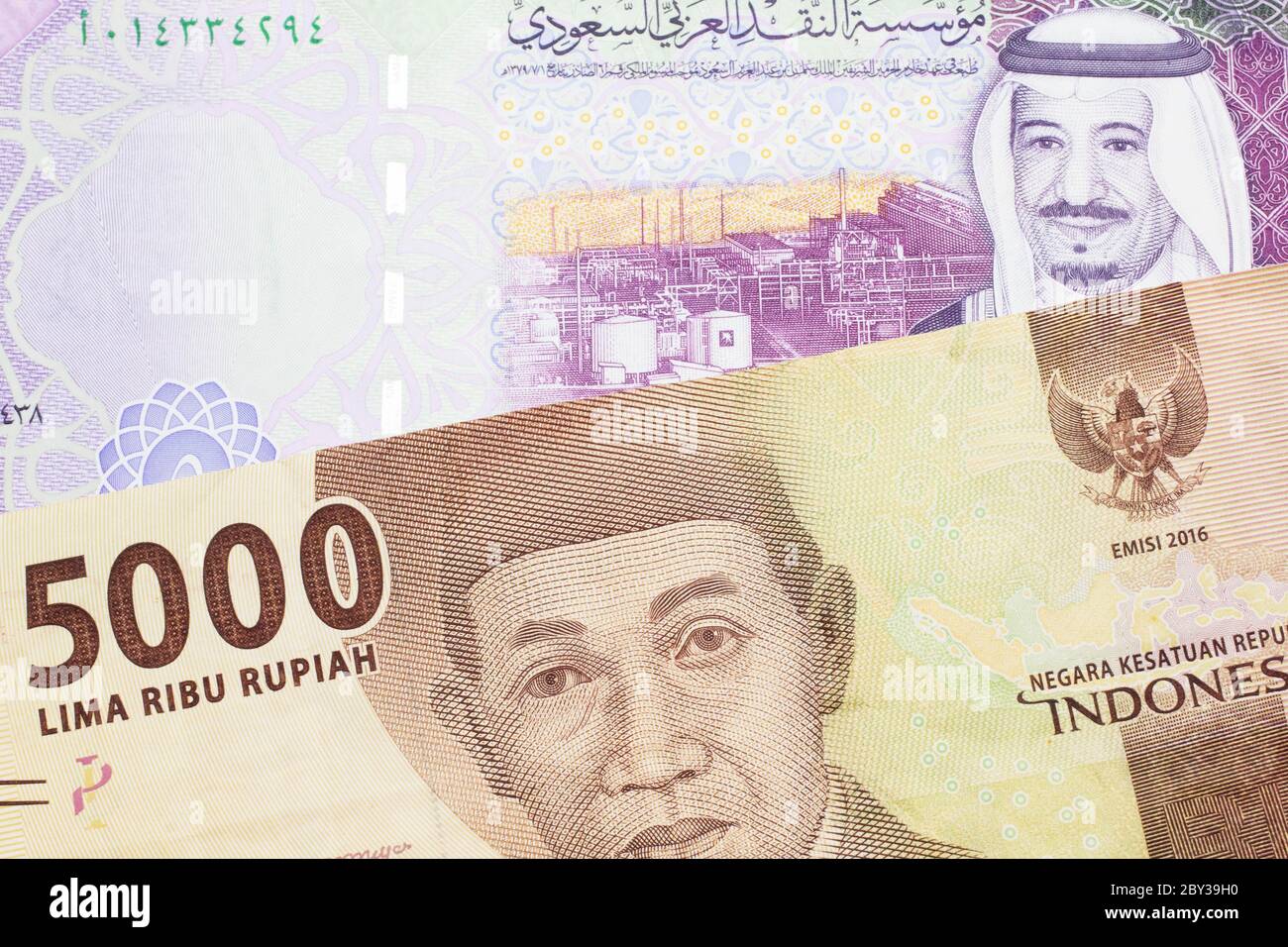 A Five Riyal Note From Saudi Arabia With A One Thousand Ugandan Shilling Bill Close Up In Macro Stock Photo Alamy
