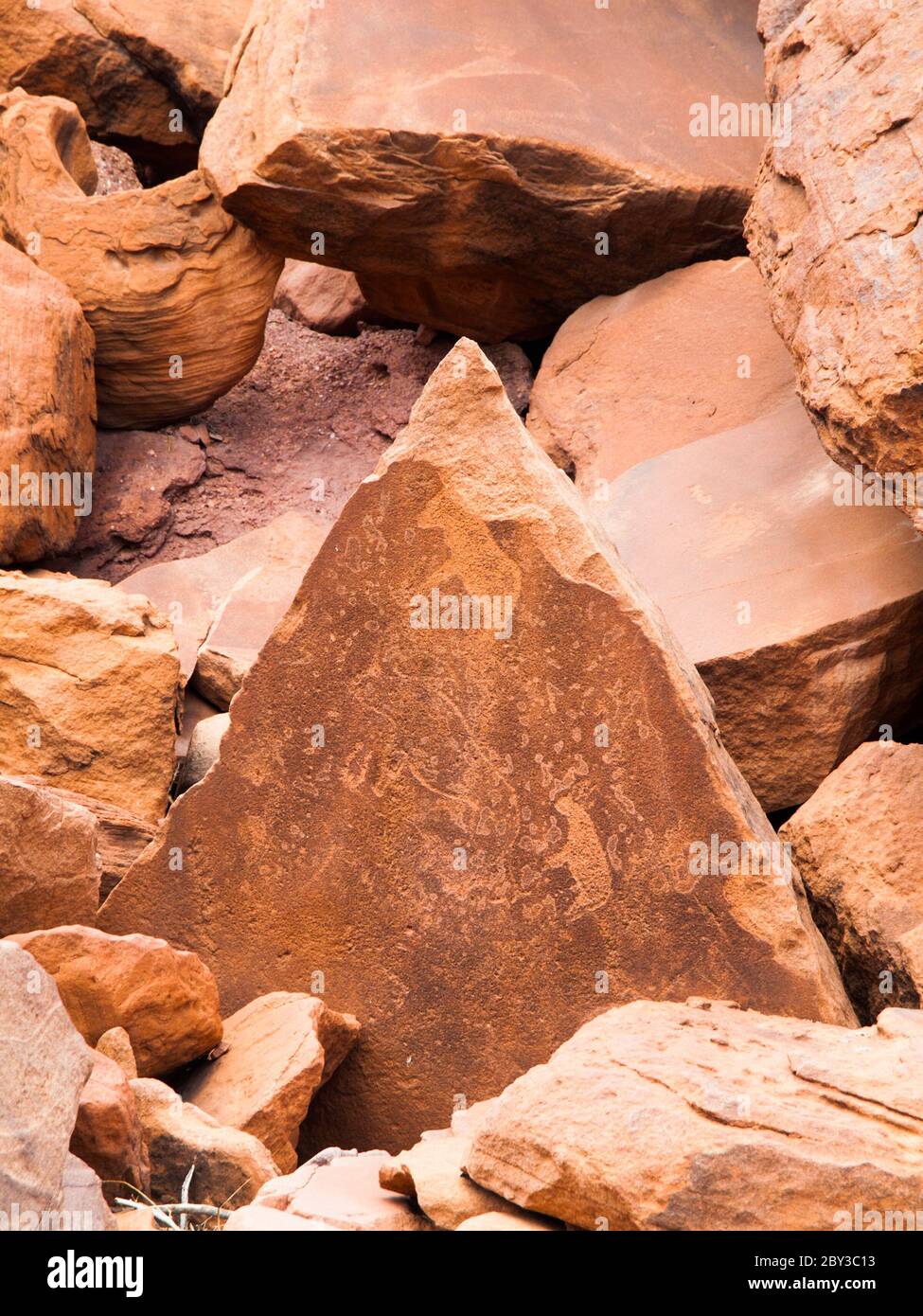 Bushman prehistoric rock engravings in Twyfelfontein, Namibia. Stock Photo