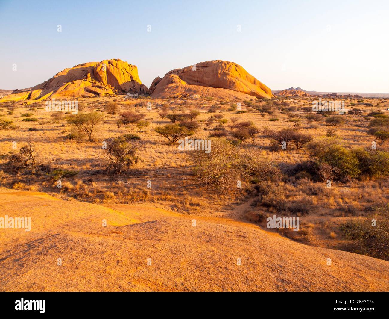 Landscape around Spitzkoppe, aka Spitzkop, with massive granite rock formations, Namib Desert in Namibia, Africa. Stock Photo