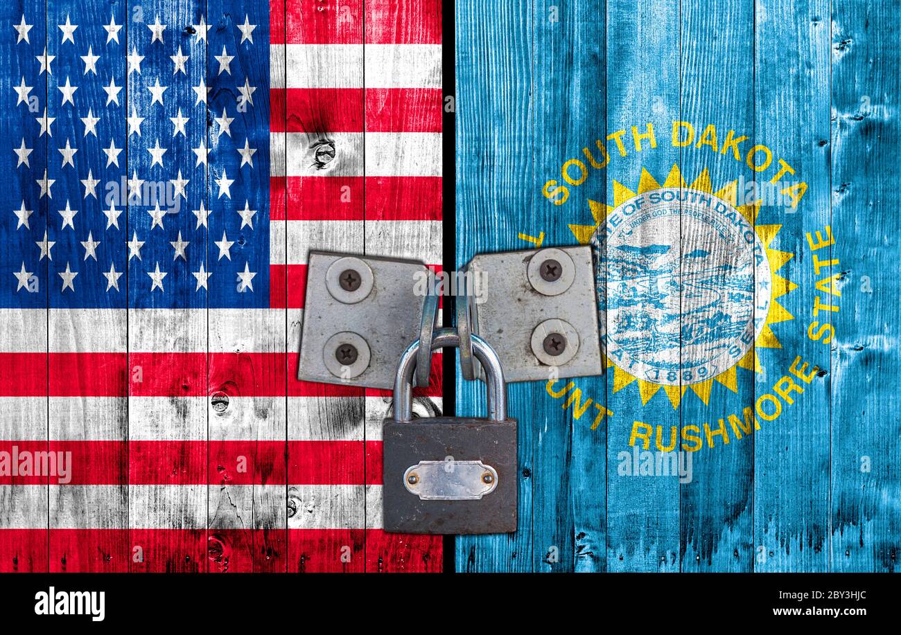 US and South Dakota flag on door with padlock Stock Photo