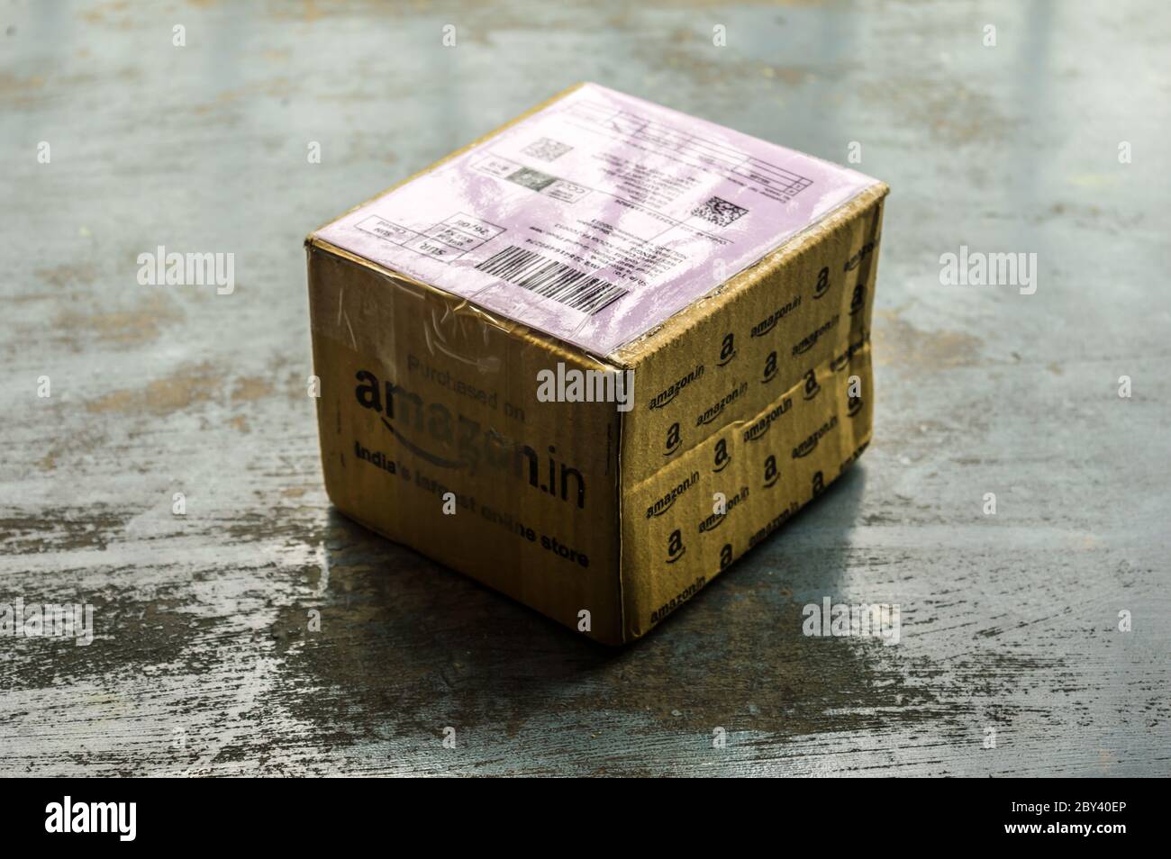 Close-up Amazon Prime package box unpacked after delivery on Amazon Prime Day. Amazon Logo printed on Amazon delivery box. Kolkata India South Asia Pa Stock Photo