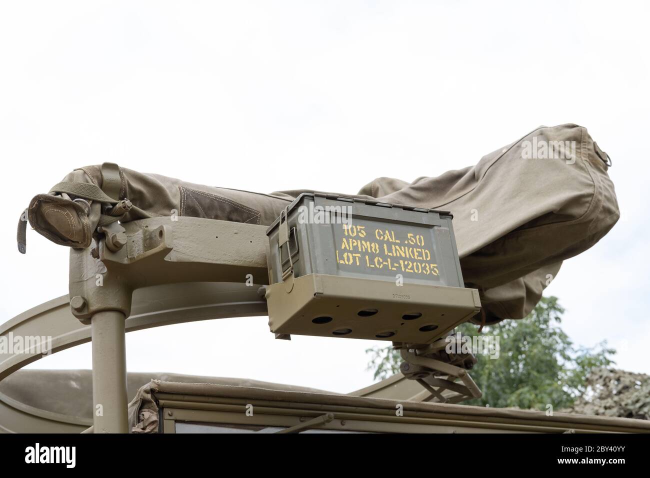World War Two machine gun turret and ammo box seen atop of a US Army truck. Used as part of a film set. Stock Photo