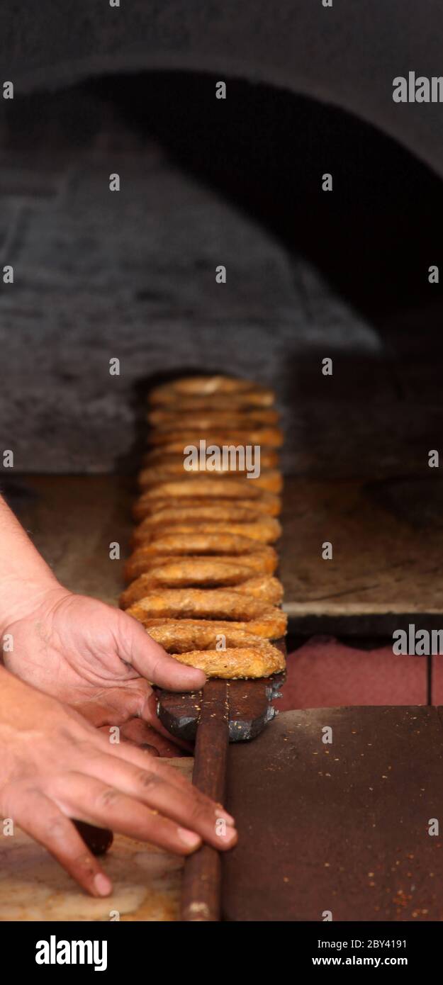 Group portrait of several young guys and one elderly man near stall with  turkish bagel at Taksim in Beyoglu, Istanbul Stock Photo - Alamy