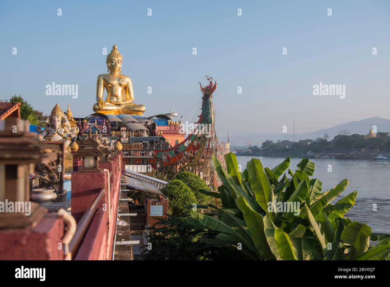 the Giant Buddha on the Dragon Boat Temple at the Mekong River in the town of Sop Ruak in the golden triangle in the north of the city Chiang Rai in N Stock Photo