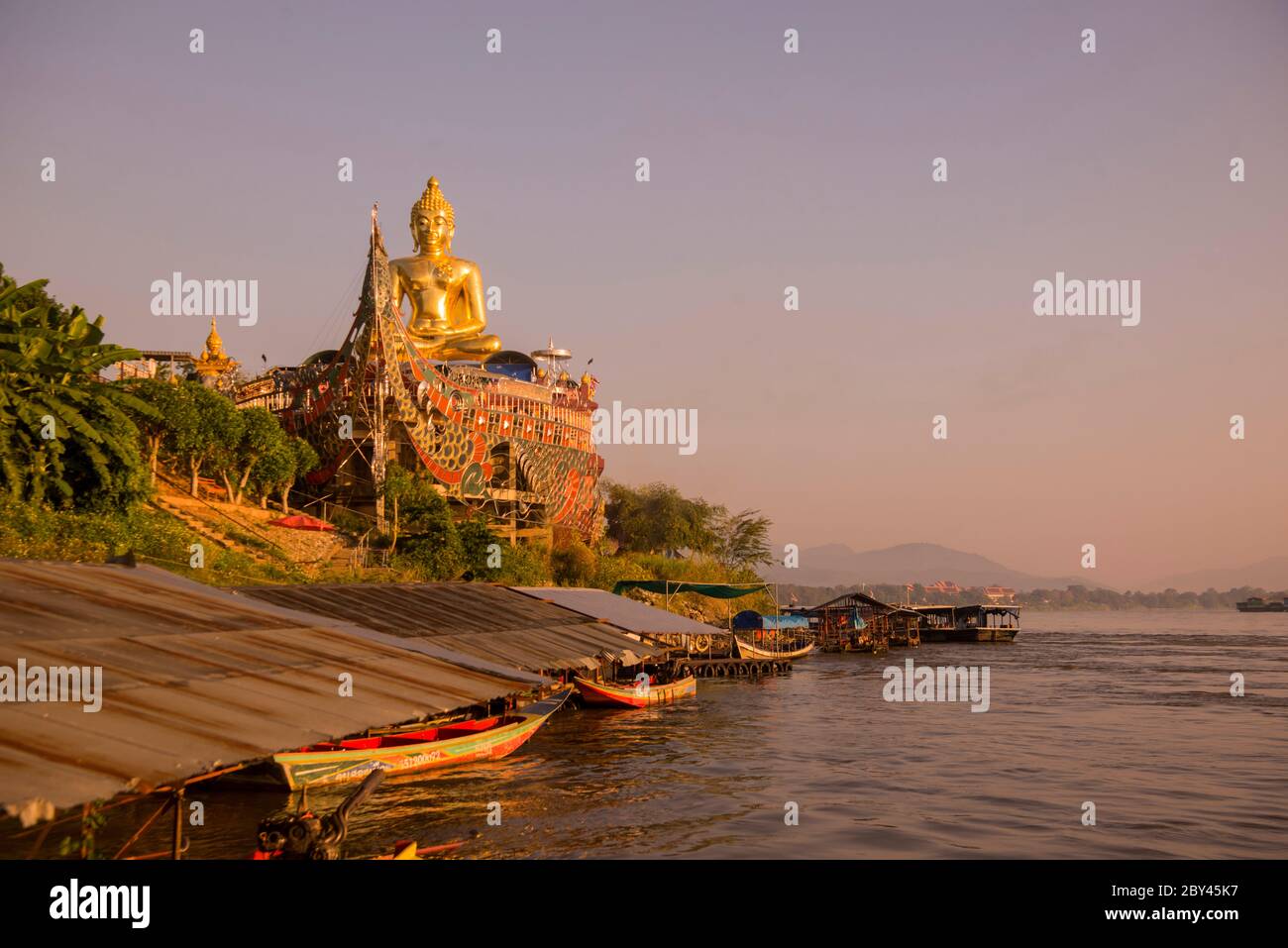 the Giant Buddha on the Dragon Boat Temple at the Mekong River in the town of Sop Ruak in the golden triangle in the north of the city Chiang Rai in N Stock Photo