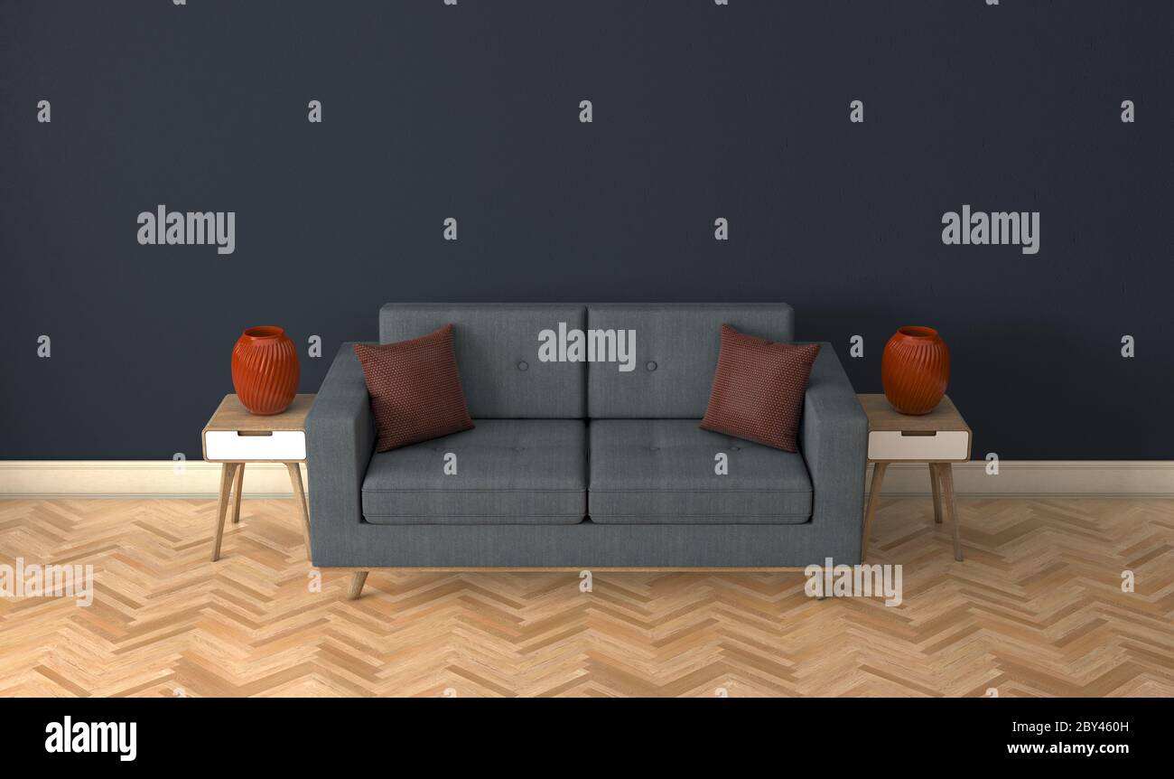 A grey couch in a modernly decorated room with side tables and burgundy