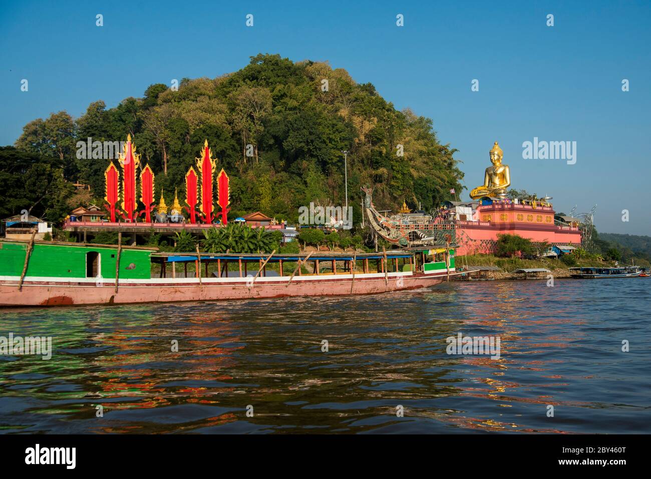 the Giant Buddha on the Dragon Boat Temple at the Mekong River in the town of Sop Ruak in the golden triangle in the north of the city Chiang Rai in N Stock Photo