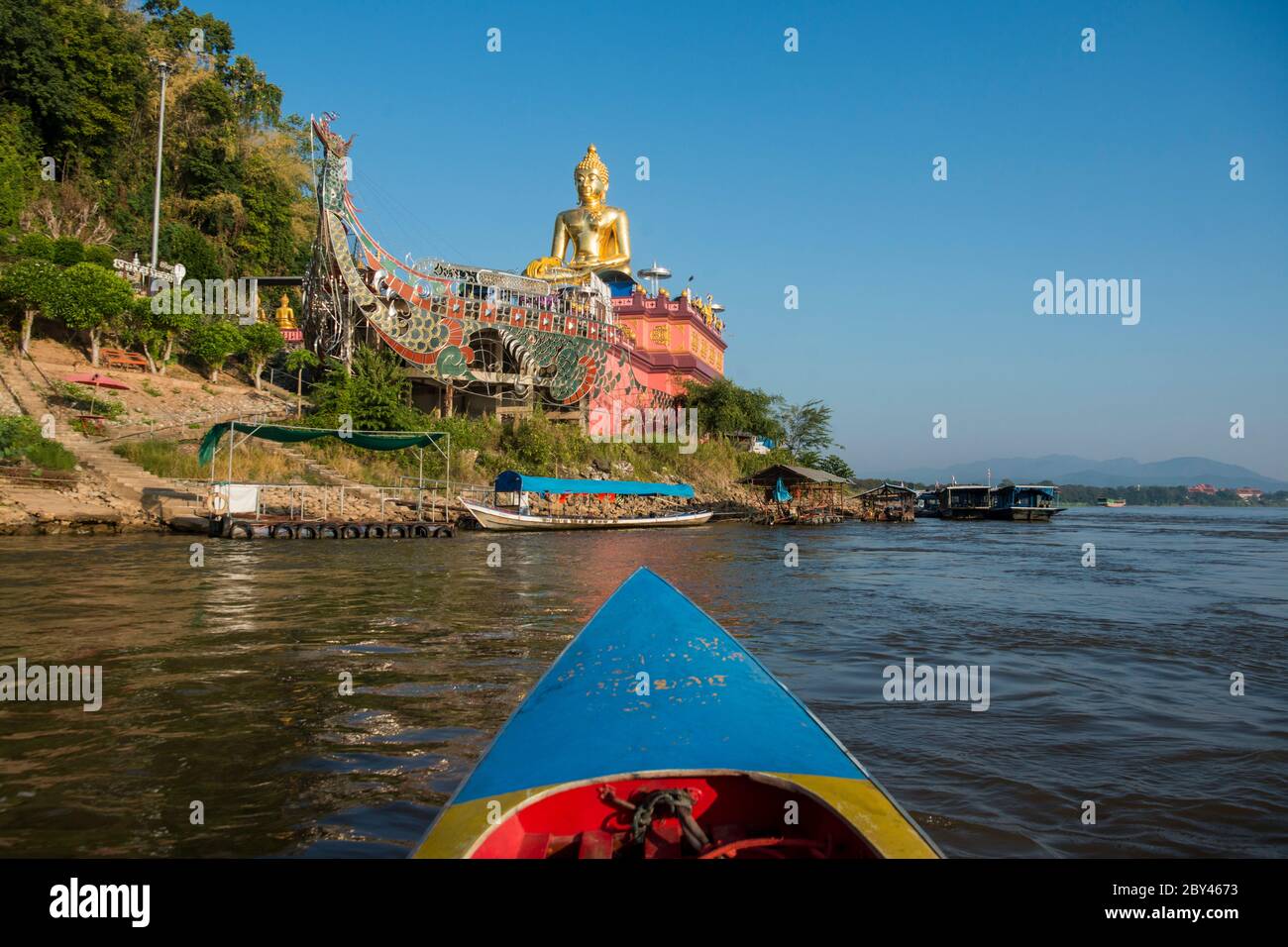 the Giant Buddha on the Dragon Boat Temple at the Mekong River in the town of Sop Ruak in the golden triangle in the north of the city Chiang Rai in N Stock Photo