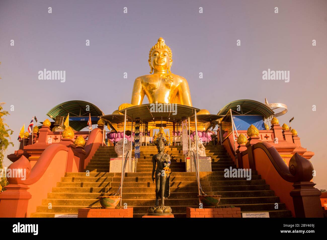 the Giant Buddha on the Dragon Boat Temple at the Mekong River in the town of Sop Ruak in the golden triangle in the north of the city Chiang Rai in N Stock Photo