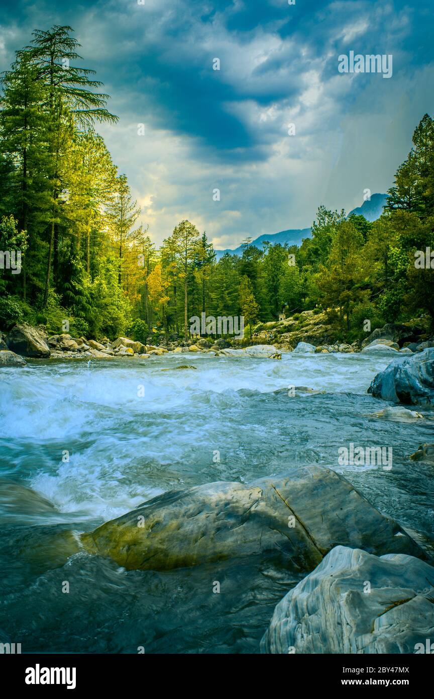 Parvati River flows through the forest with strong currents, Kasol, Himachal Pradesh India. Stock Photo